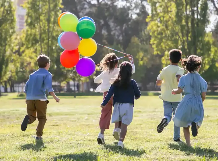 kids running with balloons